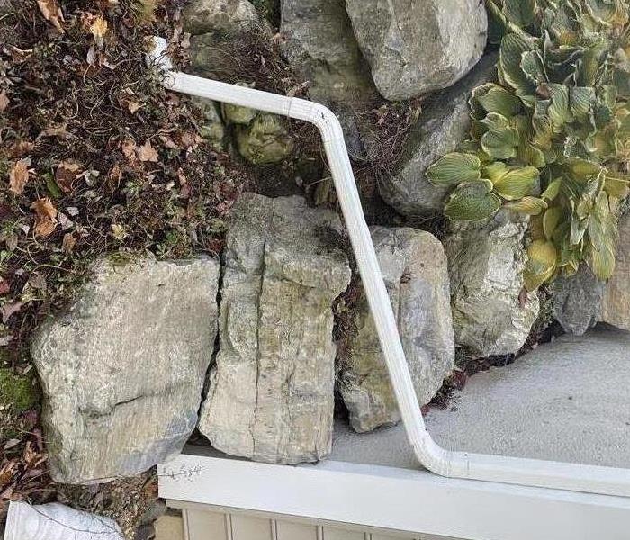 This gutter should be directed further away from the house 